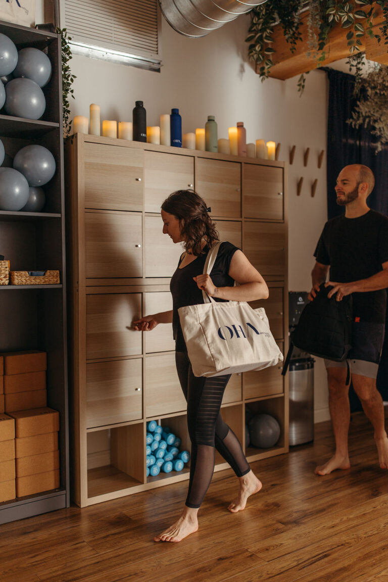 Students arriving at OHA Wellness in Liberty Village, Toronto, preparing for their yoga and meditation class in a calm and inviting space.
